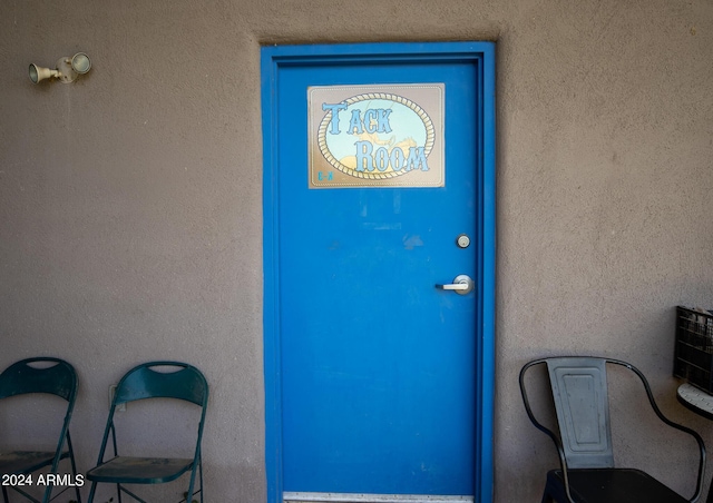 doorway to property with stucco siding