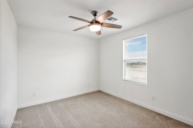 carpeted empty room with ceiling fan