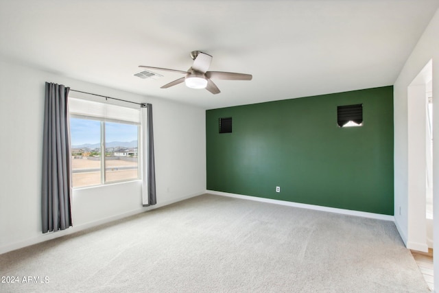 carpeted empty room with ceiling fan