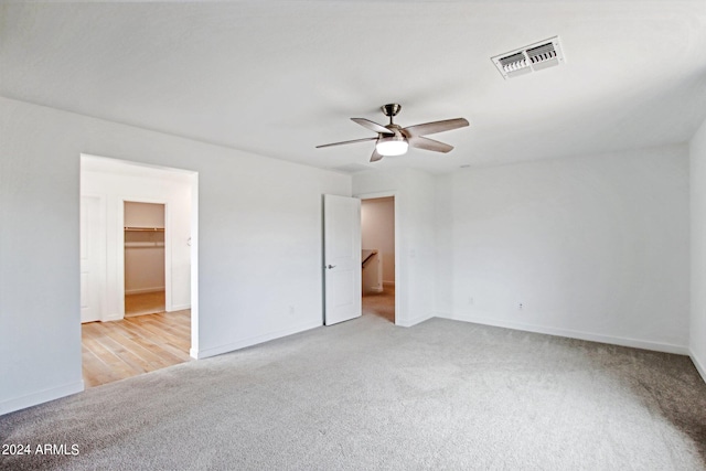 spare room with light carpet and ceiling fan