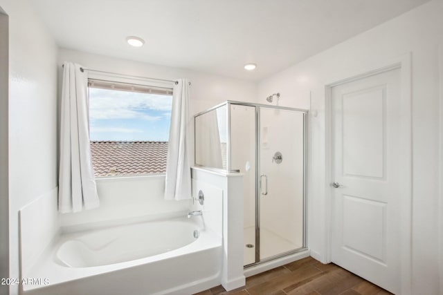 bathroom with shower with separate bathtub