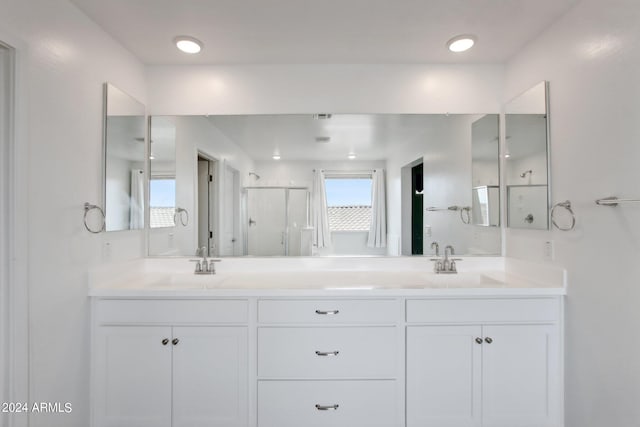 bathroom with dual bowl vanity