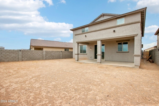 back of house with a patio area