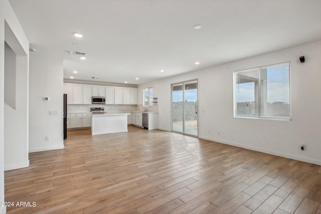 unfurnished living room with light hardwood / wood-style floors