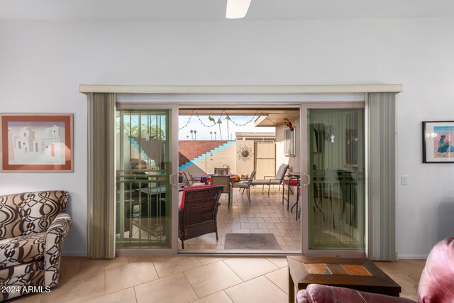 doorway to outside with light tile patterned floors