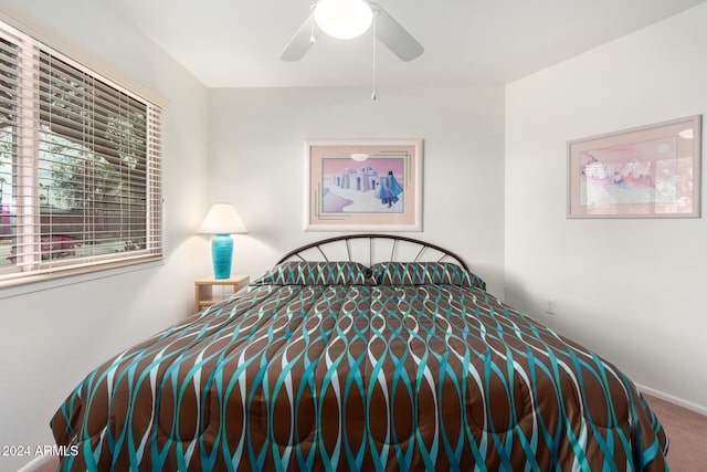 carpeted bedroom featuring ceiling fan