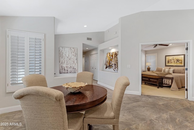 dining room with high vaulted ceiling, recessed lighting, visible vents, and baseboards