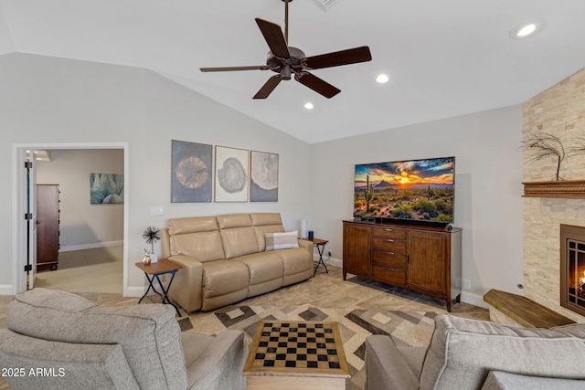 living area featuring lofted ceiling, a stone fireplace, a ceiling fan, and recessed lighting