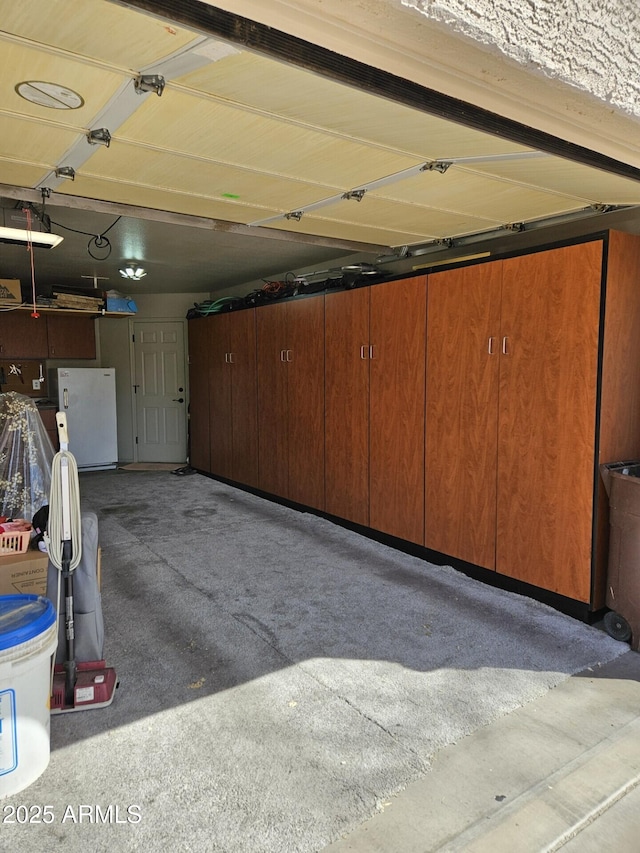 garage with freestanding refrigerator