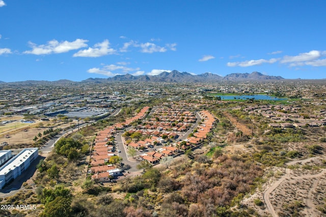 birds eye view of property with a mountain view