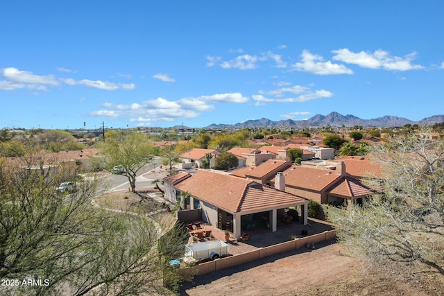 birds eye view of property with a residential view and a mountain view