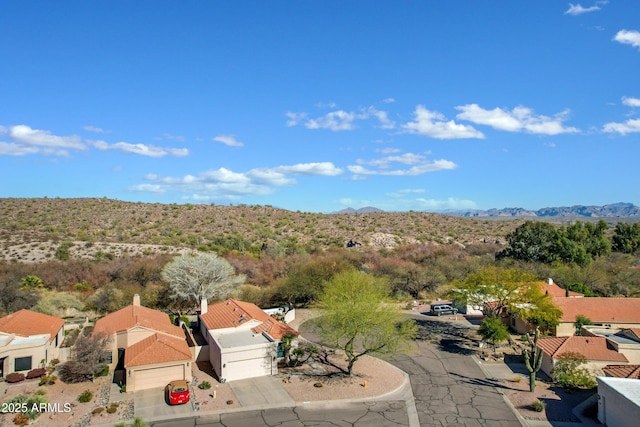 aerial view with a mountain view and a residential view