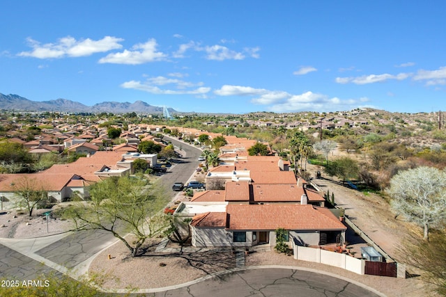 drone / aerial view featuring a residential view and a mountain view