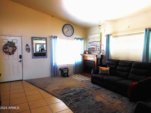 tiled living room featuring vaulted ceiling