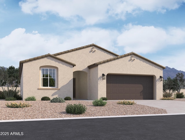 mediterranean / spanish-style house featuring a tiled roof, an attached garage, driveway, and stucco siding