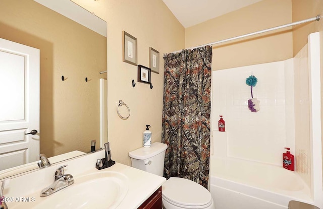 full bathroom with toilet, shower / bath combo with shower curtain, and vanity