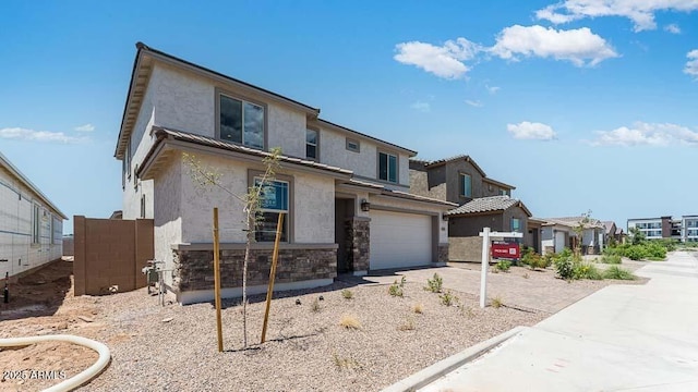 view of front of property with stucco siding, a residential view, stone siding, and fence