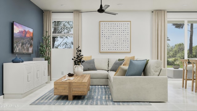 living room featuring plenty of natural light and a ceiling fan