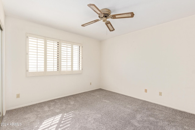 carpeted empty room with ceiling fan