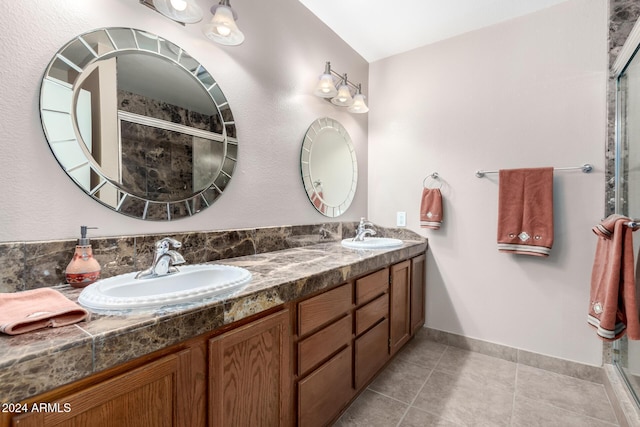 bathroom with vanity, tile patterned floors, and walk in shower