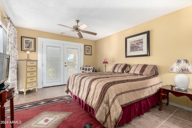 bedroom with ceiling fan, french doors, tile patterned floors, a textured ceiling, and access to outside