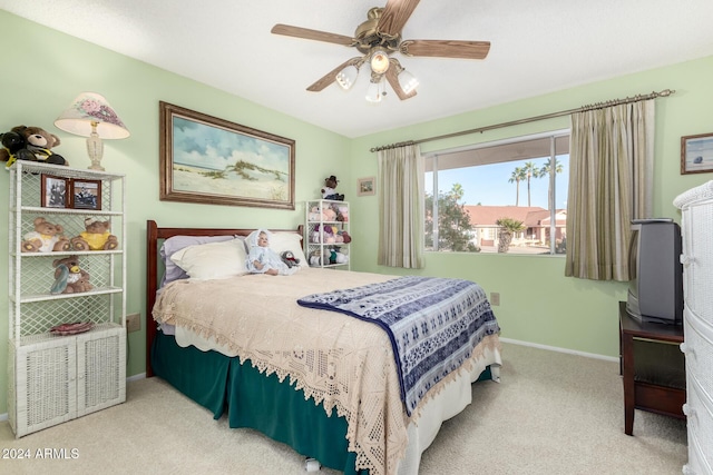 bedroom featuring ceiling fan and carpet