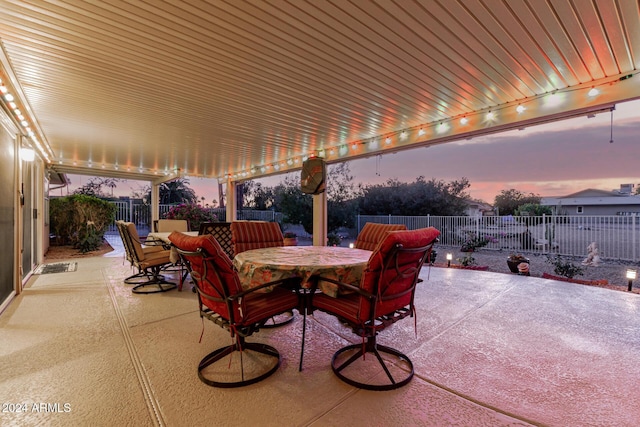 view of patio terrace at dusk