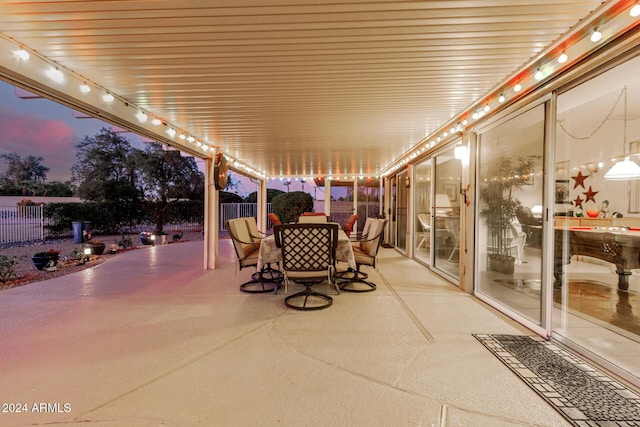 view of patio terrace at dusk