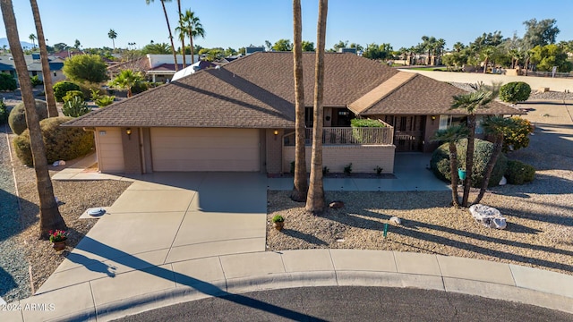 ranch-style home featuring a garage