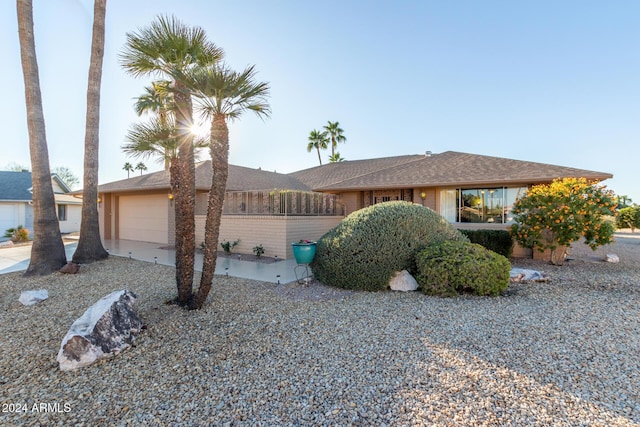 ranch-style home featuring a garage