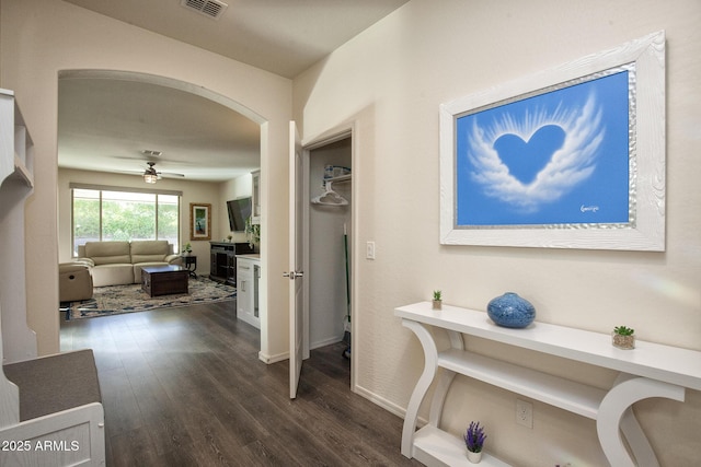 hall with dark hardwood / wood-style floors