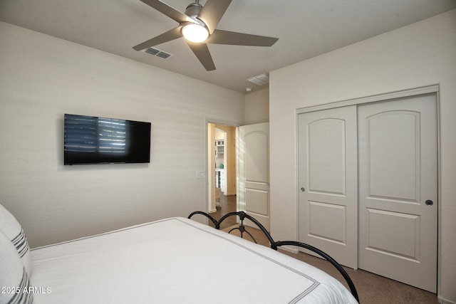 carpeted bedroom with a closet and ceiling fan