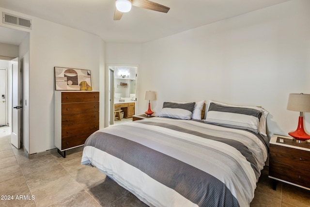 bedroom featuring ensuite bath and ceiling fan