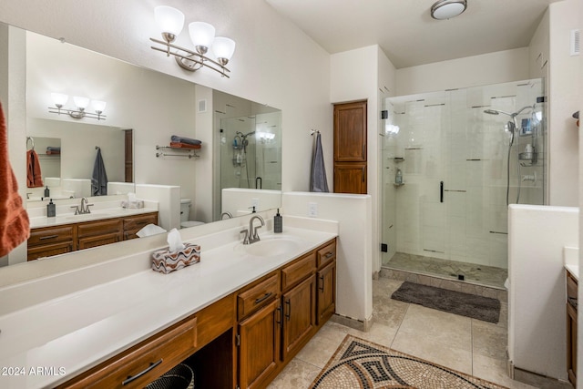 bathroom with vanity, tile patterned floors, toilet, a notable chandelier, and an enclosed shower