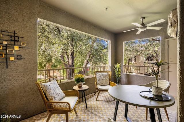 sunroom / solarium with ceiling fan