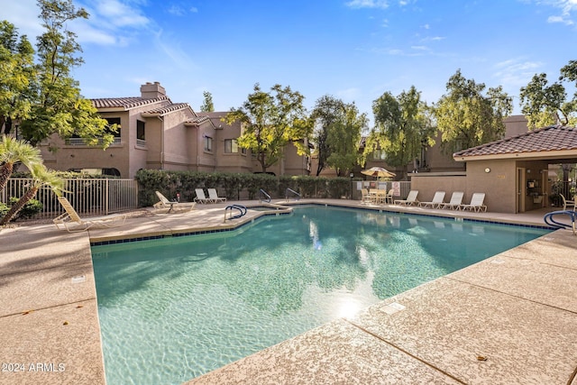 view of swimming pool with a patio