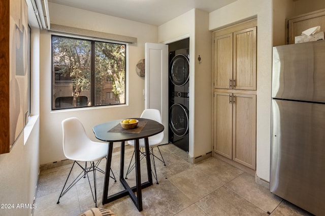 dining area with stacked washer / drying machine