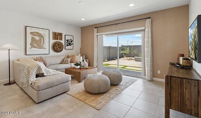 living room with recessed lighting, baseboards, and light tile patterned floors