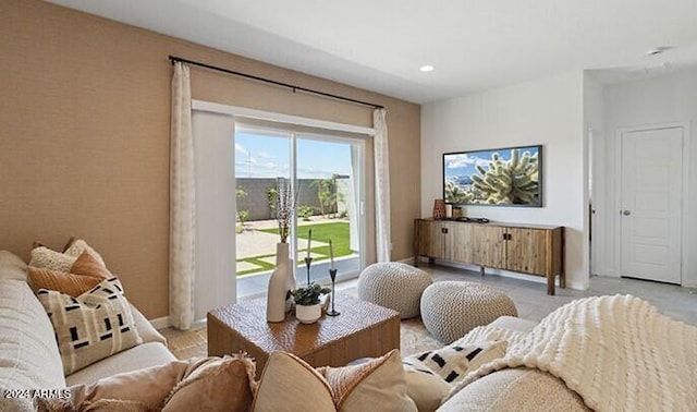 living room with recessed lighting and baseboards