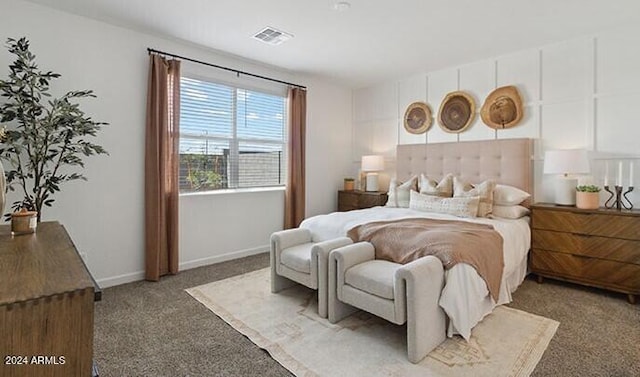 bedroom featuring baseboards, visible vents, and carpet flooring