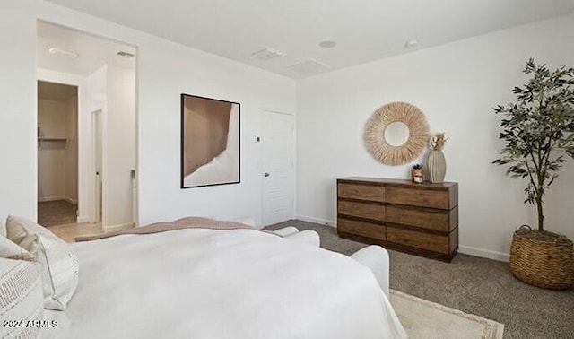 carpeted bedroom with baseboards