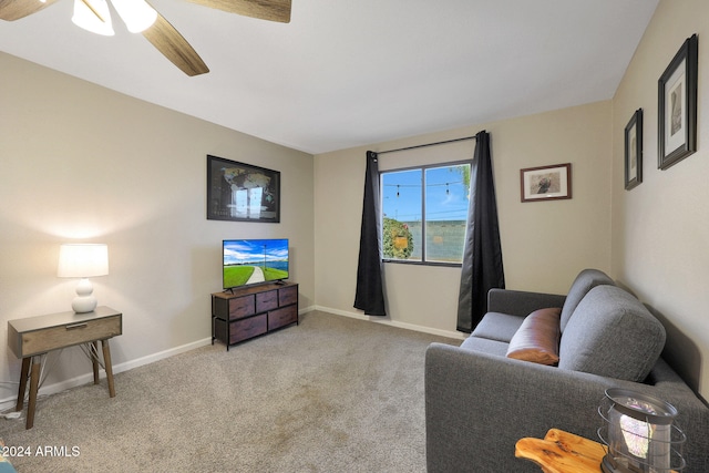 carpeted living room with ceiling fan