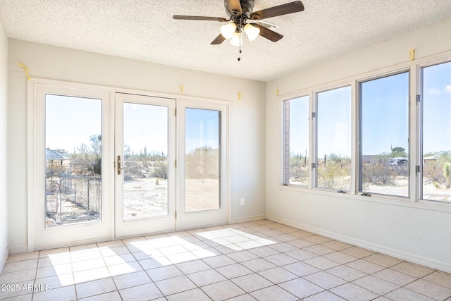 interior space with ceiling fan