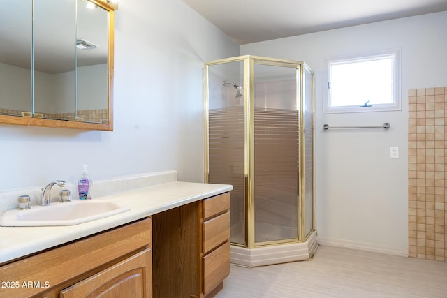 full bathroom with a stall shower, vanity, and visible vents