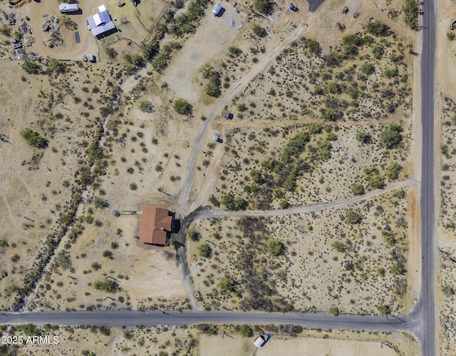 birds eye view of property featuring view of desert