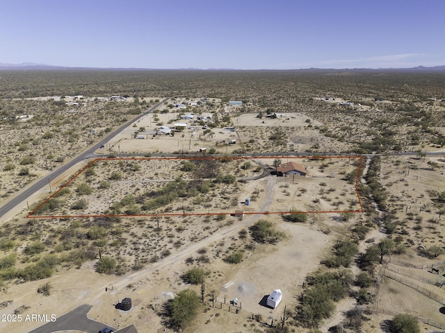 bird's eye view with a desert view