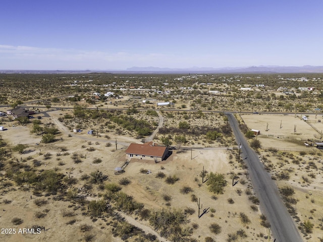 birds eye view of property with view of desert and a rural view