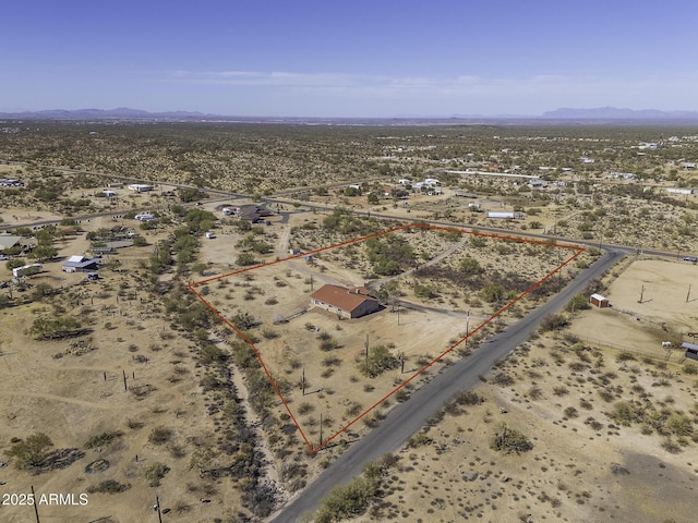 bird's eye view with view of desert and a mountain view