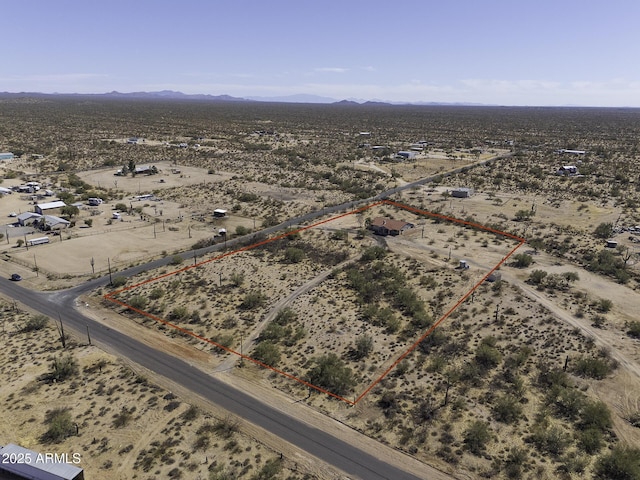 aerial view with view of desert and a mountain view