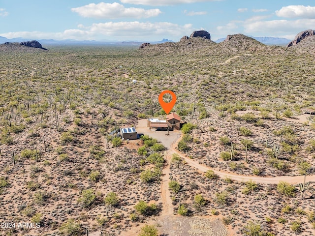 birds eye view of property featuring a mountain view